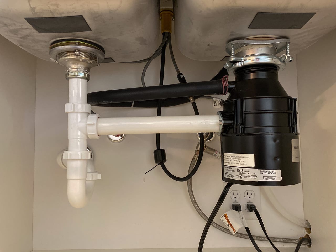 Residential sink drain trap, connected pipes and disposal equipment